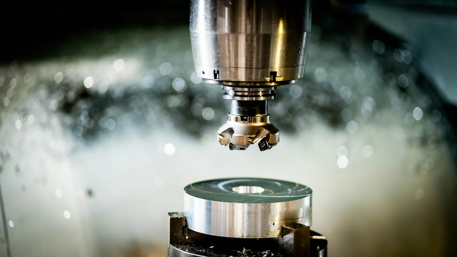CNC milling cutter machining a precision metal component